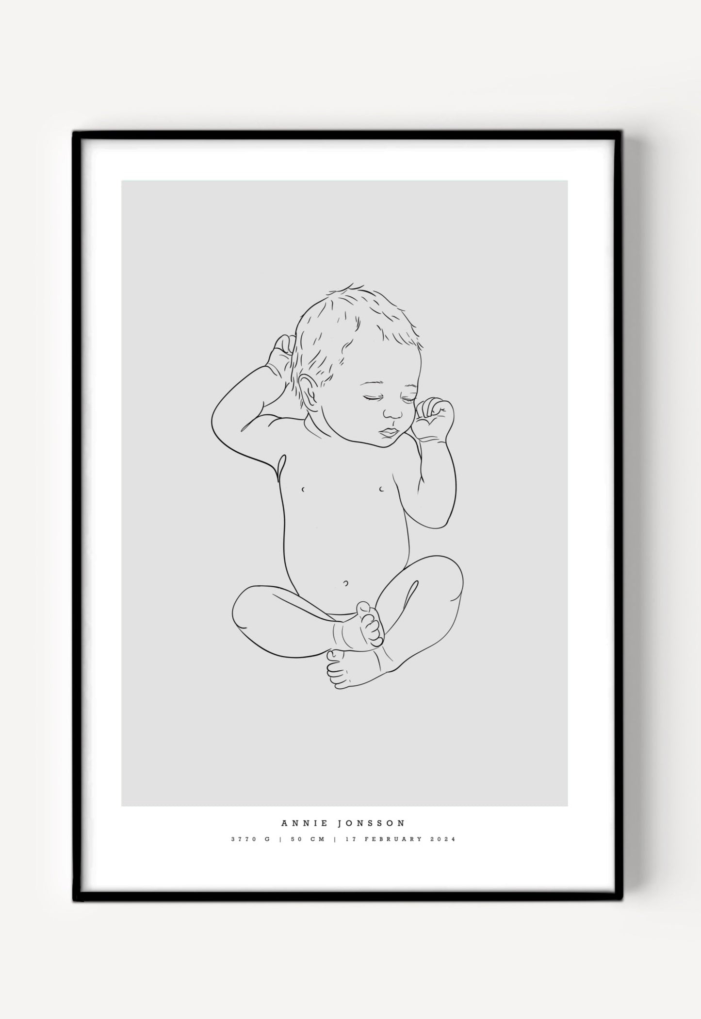 Illustration of a baby boy lying on his back with one arm raised, featured on a birth poster